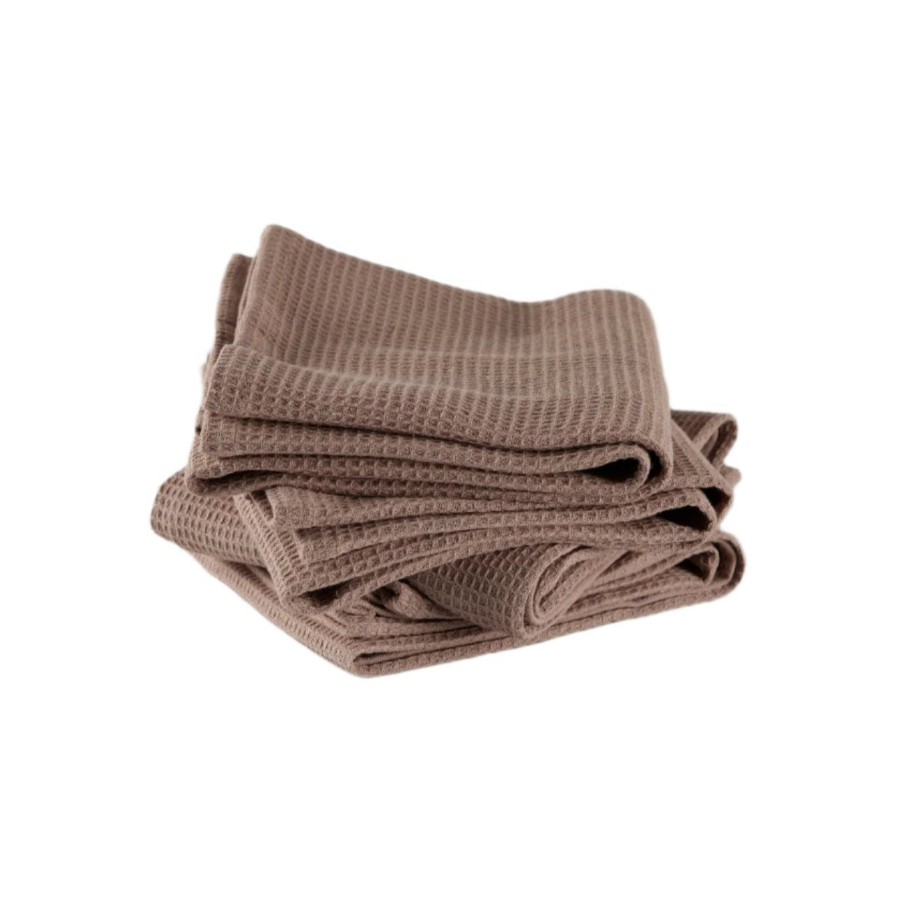 Stack of folded light brown waffle-textured cotton kitchen towels on a white background, showcasing their texture and soft, casual draping.