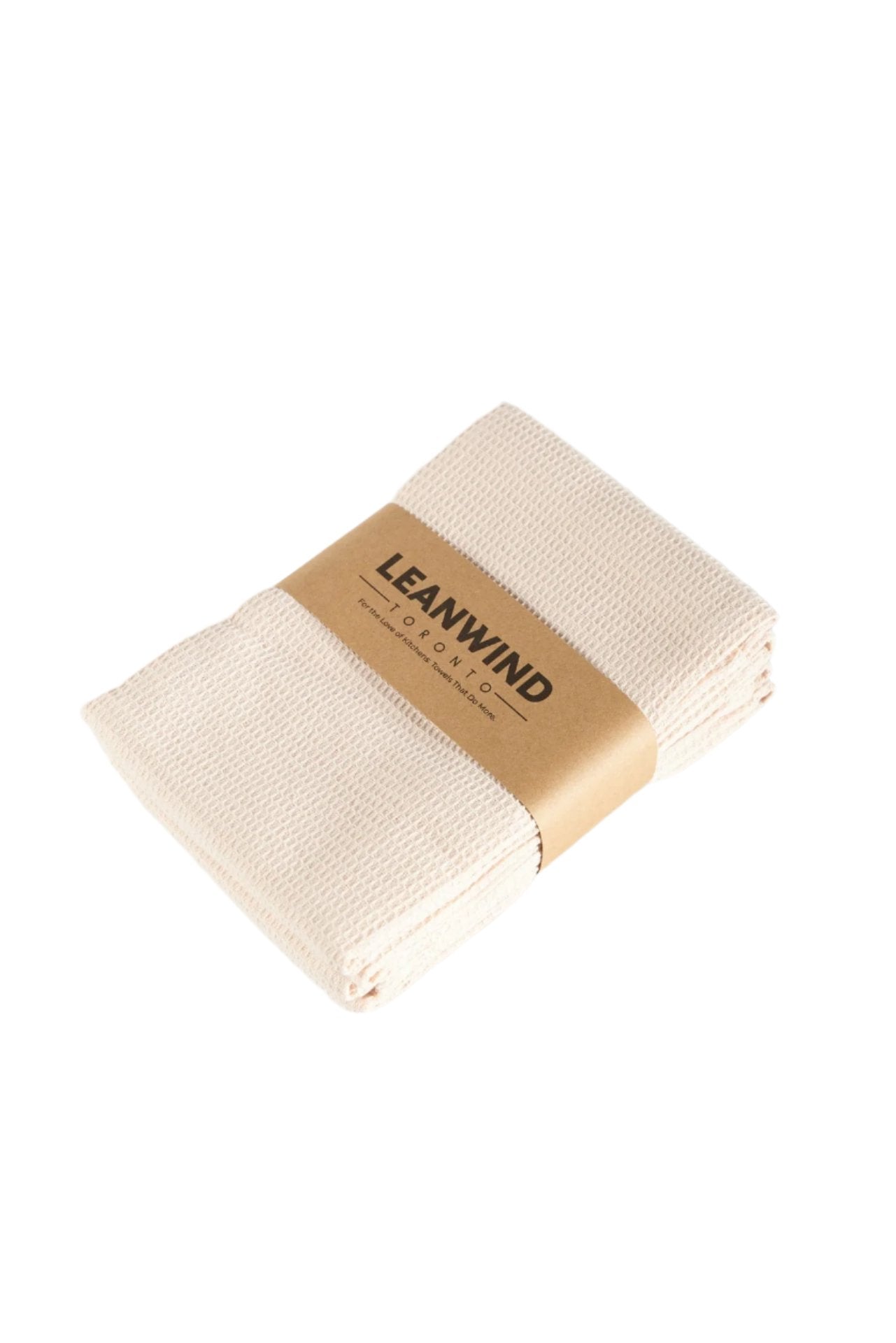 Folded cream-colored waffle-textured kitchen towels with a brown paper band labeled &quot;LEANWIND TORONTO&quot; wrapped around the middle, displayed on a white background.